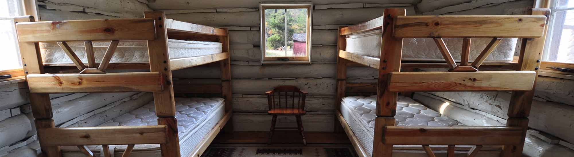 Two bunk beds inside a cabin.