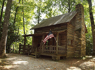 A larger cabin in the forest.