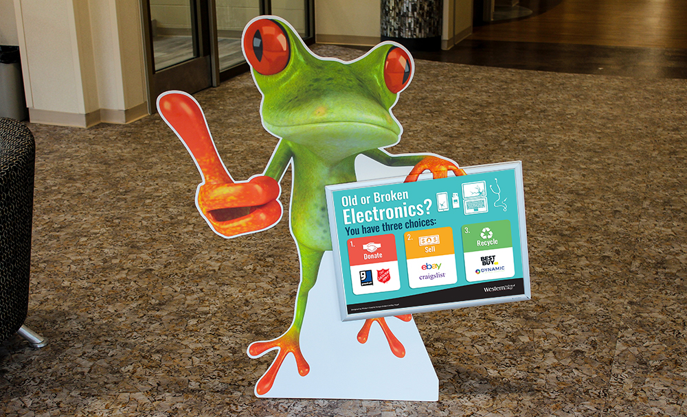 Neon Leon frog holding a sign